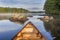 Bow of canoe on a lake in early morning - Ontario, Canada