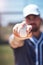 Bow down to the almighty baseball. a man holding a ball during a baseball match.