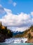 Bow Falls in Banff, Alberta, Canada under bright, sunny, blue fall skies