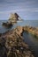 Bow-fidle Rock landscape on the coast of Scotland on cloudy afternoon