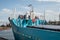 Bow of an old cargo ship in a harbor