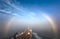 The bow of a small tanker on a background of the misty rainbow.