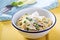 Bow ties pasta with ham and green peas