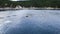 Bowhead whale family swimming together in calm blue ocean water, Aerial view of a pod of bowhead whale spouting. Whale