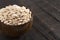 Bowl of Baby Lima Beans or Butter Beans on a Rustic Wooden Table