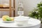 Bowl with baking soda, lemons and bottle of vinegar