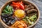 Bowl of bibimbap on the wooden table