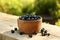 Bowl of bilberries on wooden table outdoors