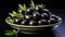 A bowl of black olives with a sprig of rosemary