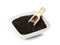 Bowl of black rice with wooden shovel