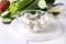 Bowl of Bocconcini Mozzarella Fresh Tomatoes Cucumber Celery Olive Oil Italian Salad Healthy Food White Background