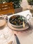 Bowl with boiled mussels. Moules in a white sauce. Appetizer and white wine.