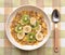 Bowl of Breakfast Cereal with Banana and Kiwi Fruit