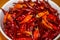 A bowl of bright red dried chili close-up