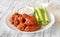 Bowl of buffalo wings with blue cheese dip