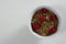 Bowl of cereal bran stick and raspberries