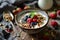 a bowl of cereal, granola, berries and chia seeds