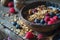 a bowl of cereal, granola, berries and chia seeds