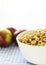 Bowl with cereals and apples