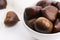 Bowl of chestnuts on a white background