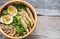 Bowl of chicken ramen soup on the wooden table