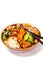 A bowl of chicken Teriyaki garnished with vegetables and rice. White background, text space.