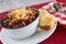Bowl of Chili Comfort Food With Corn Bread Muffin Horizontal