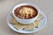 bowl of chilli soup with cheese and whole wheat saltine crackers.