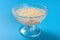 Bowl of Chinese syrup of sago on blue background
