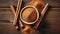 Bowl of cinnamon powder and sticks on wooden table. Flat lay