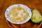 A bowl of Colombian mote de queso, thick yam soup with onion, garlic, peasant cheese cubes