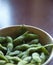 Bowl of cooked and salted edamame pods
