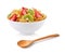 Bowl of corn flakes with fruit and wooden spoon