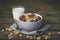 Bowl of Cornflakes, Blueberries, raspberries and glass of milk