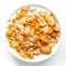 Bowl of cornflakes in milk isolated on white.