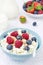 Bowl of cottage cheese with berries, honey