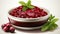 A bowl of cranberry sauce with a sprig of mint