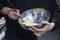 Bowl with cream being stirred on a chefÂ´s hands.