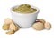 Bowl of creamy pistachio butter and nuts on white background