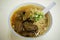 A bowl of curry beef brisket noodle soup in Macau, China