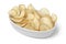 Bowl with deep fried cassava chips close up on white background