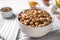 Bowl with delicious chickpeas on table, closeup