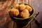 Bowl with delicious nuggets on table