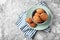 Bowl with delicious oatmeal cookies on light background