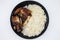 Bowl of Delicious Peruvian Chicken with Rice on a White Background