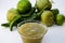 Bowl with delicious salsa sauce and ingredients on white background, closeup