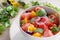 Bowl with delicious watermelon salad on plate