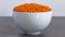 Bowl of Dhal seeds front view Neutral background