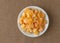 Bowl of diced cantaloupe on a tablecloth