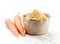 Bowl of dried carrot powder